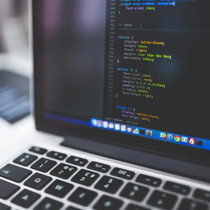 Laptop screen with custom web development code